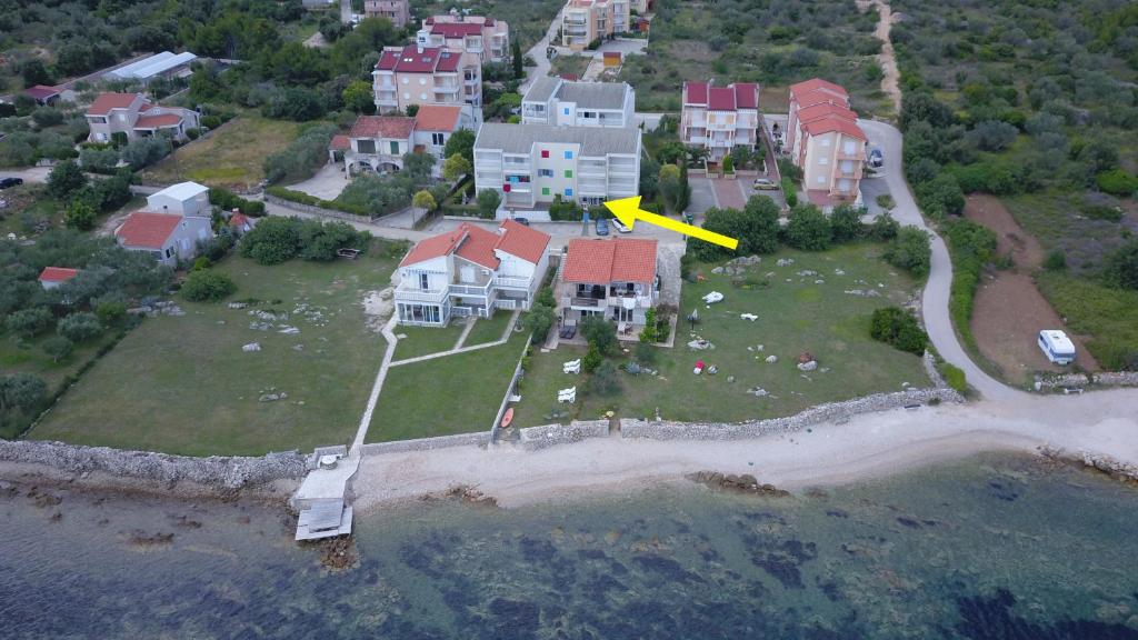 an aerial view of a house on an island at Apartman Ema Dobropoljana in Dobropoljana