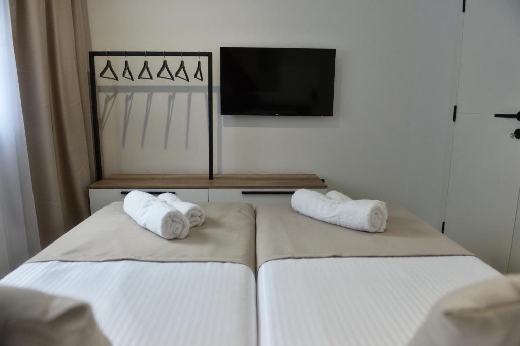 Postel nebo postele na pokoji v ubytování 9 apartments