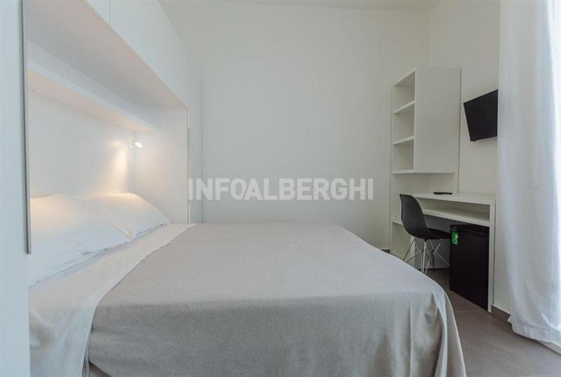Postel nebo postele na pokoji v ubytování Hotel Niagara