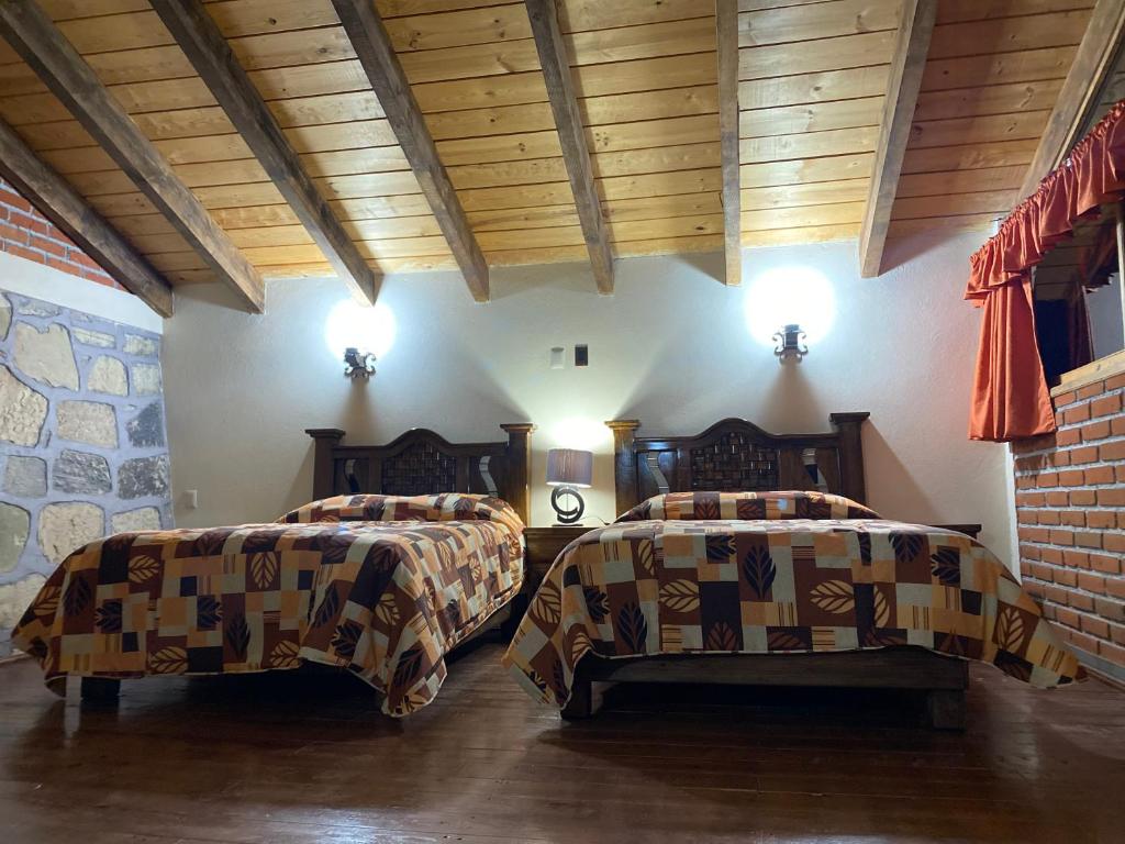 Postel nebo postele na pokoji v ubytování CABAÑAS CASTILLO