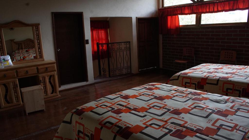 Postel nebo postele na pokoji v ubytování CABAÑAS CASTILLO