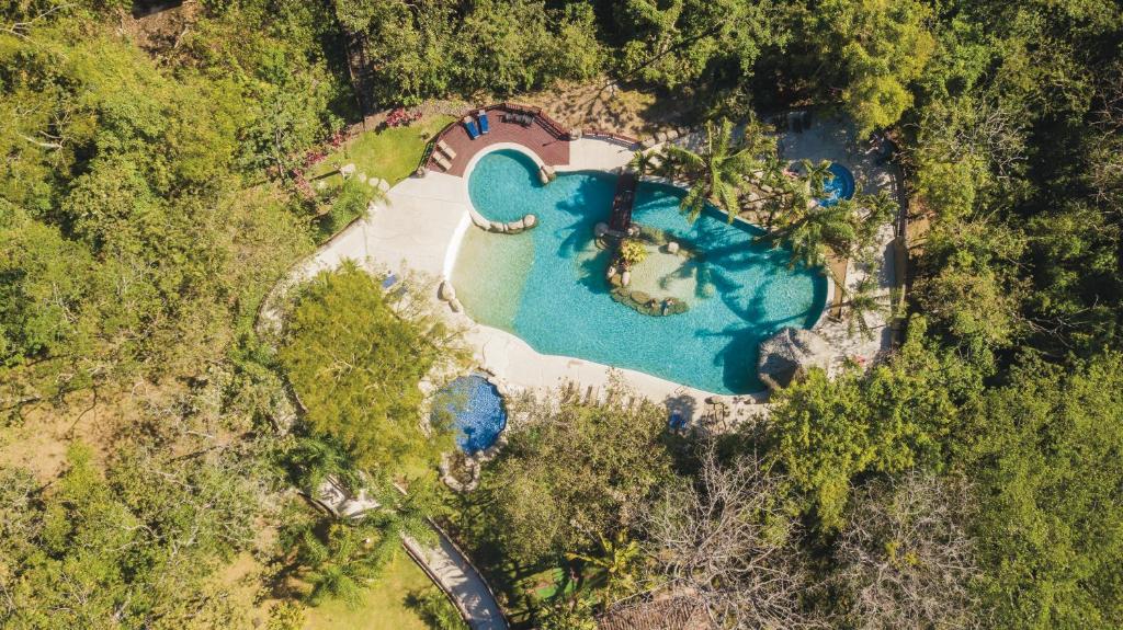 an aerial view of a house with a swimming pool at Borinquen Thermal Resort in Liberia