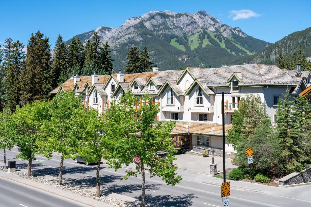 a small town with a mountain range at The Rundlestone Lodge in Banff