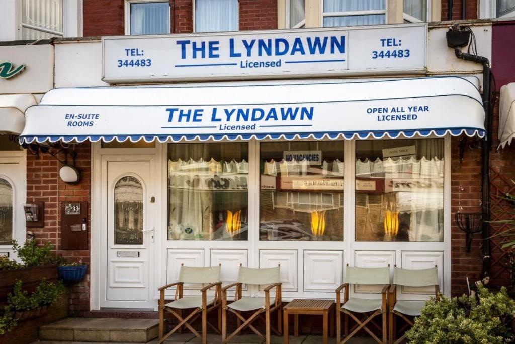 a row of chairs sitting outside of a restaurant at Lyndawn hotel in Blackpool
