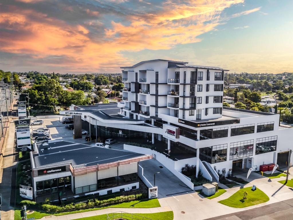 an overhead view of a large white building at Inspire Boutique Apartments in Toowoomba