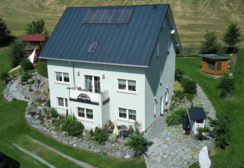 an aerial view of a house with a solar roof at Ferienwohnung Lindner in Cranzahl