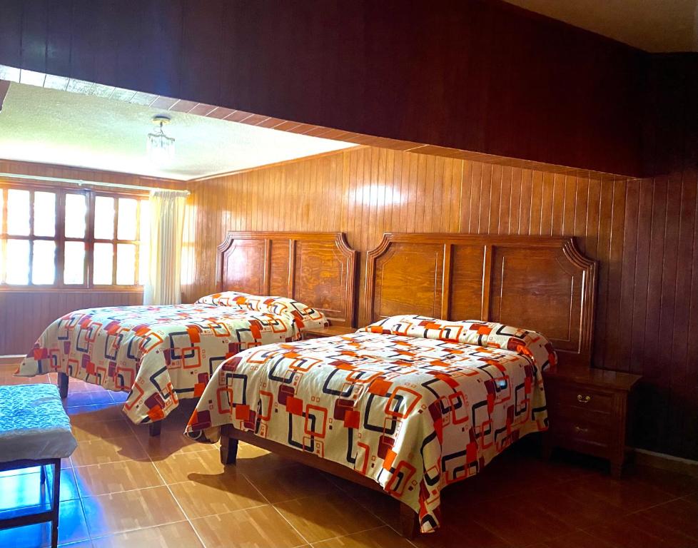 Postel nebo postele na pokoji v ubytování Posada Castillo