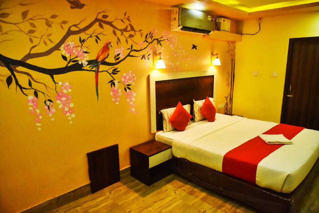 Postel nebo postele na pokoji v ubytování Ratna Resort near Bhubaneswar Airport