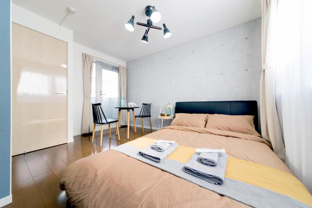 Säng eller sängar i ett rum på nestay inn tokyo ryogoku