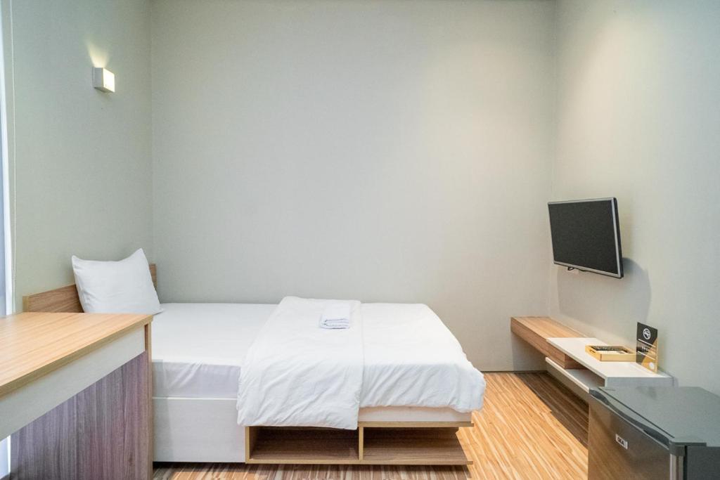 Letto o letti in una camera di Three J Residence