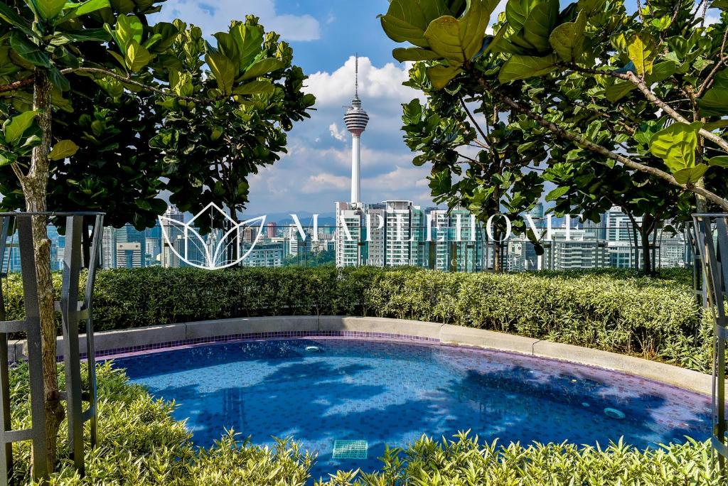 a swimming pool with a view of the city at The Robertson Kuala Lumpur in Kuala Lumpur