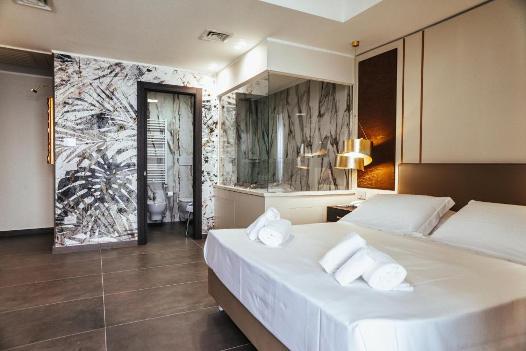 Postel nebo postele na pokoji v ubytování Hotel Palace
