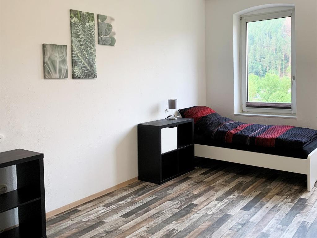 Postel nebo postele na pokoji v ubytování 3 Zimmerwohnung mit Garten