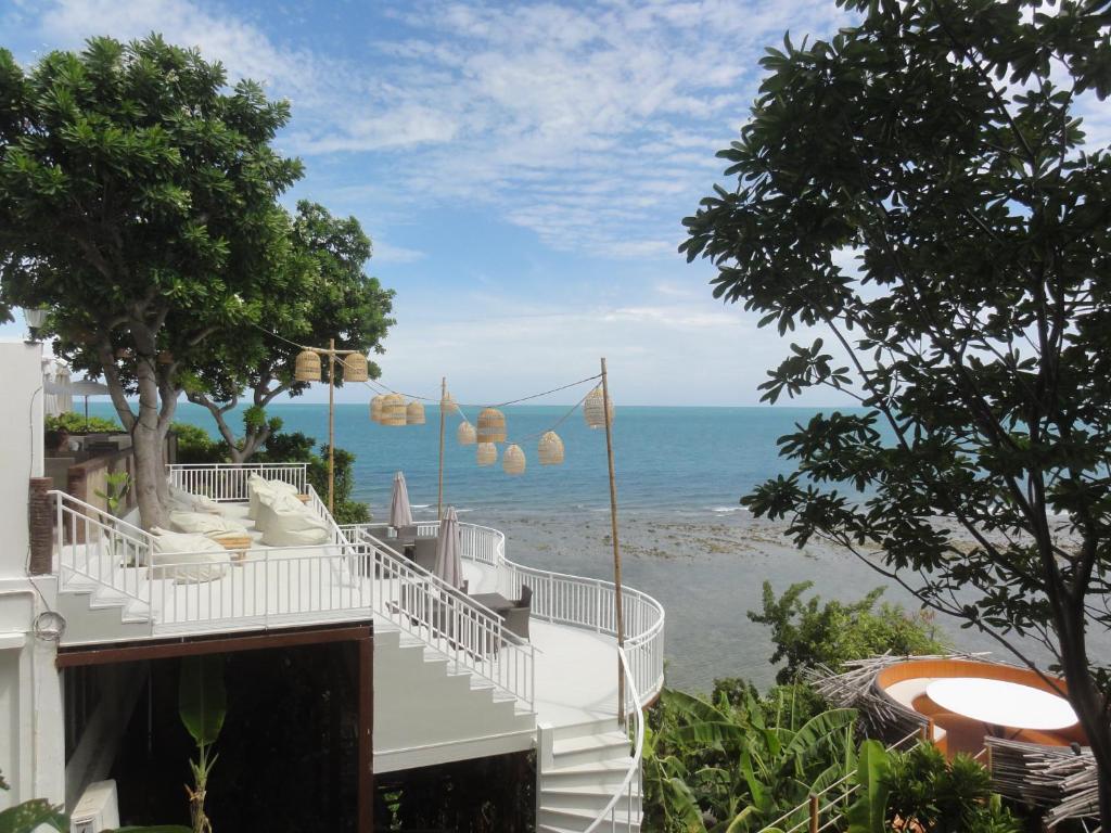 a beach with palm trees and palm trees at High Life Bungalow in Haad Yao