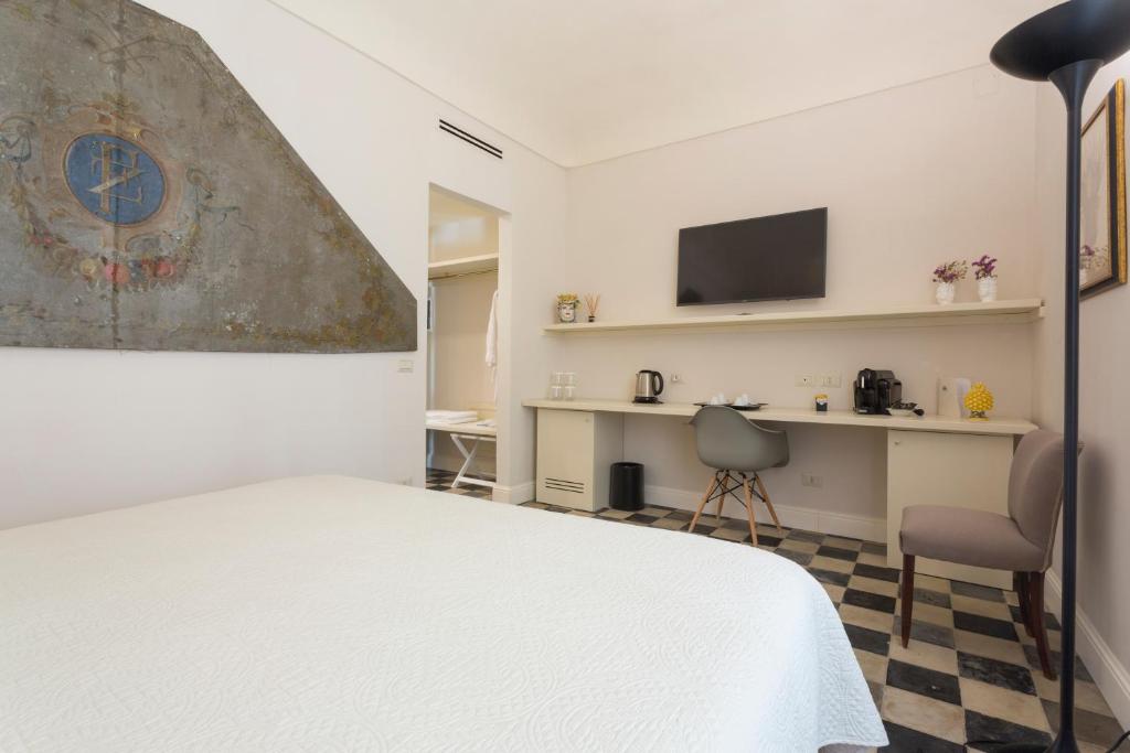 TV a/nebo společenská místnost v ubytování San Carlo Suites