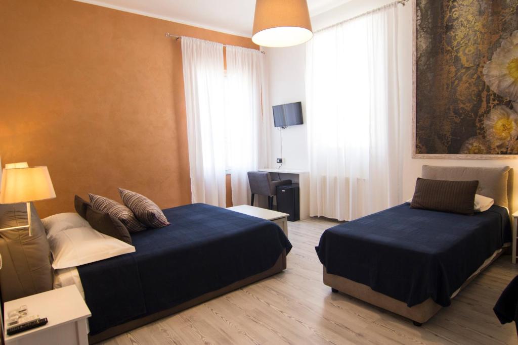Postel nebo postele na pokoji v ubytování B&B 7 Rooms