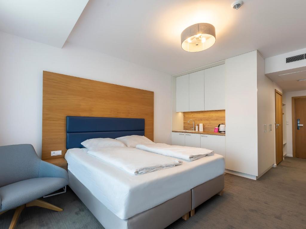 Posteľ alebo postele v izbe v ubytovaní VacationClub – Seaside Apartament 451