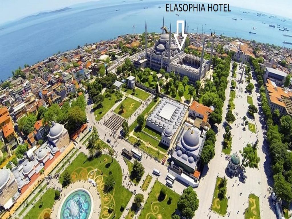 a large building with a large clock tower on top of it at Elasophia Hotel in Istanbul