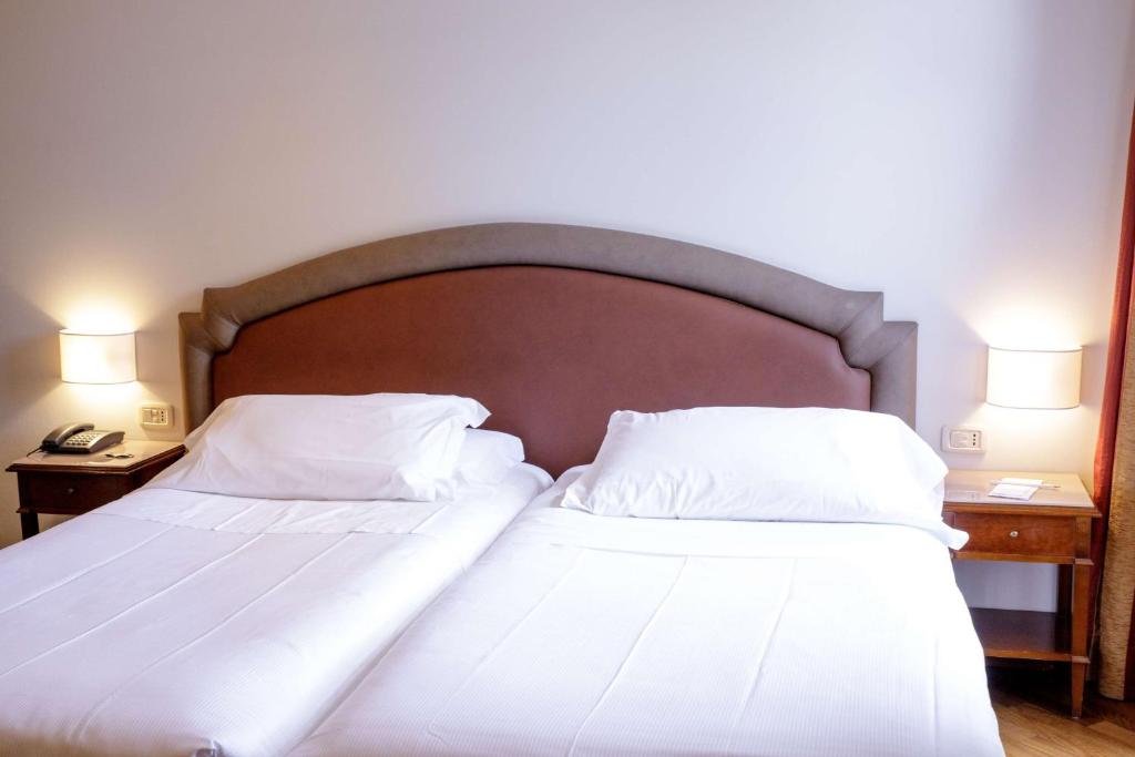 Postel nebo postele na pokoji v ubytování Best Western Ai Cavalieri Hotel