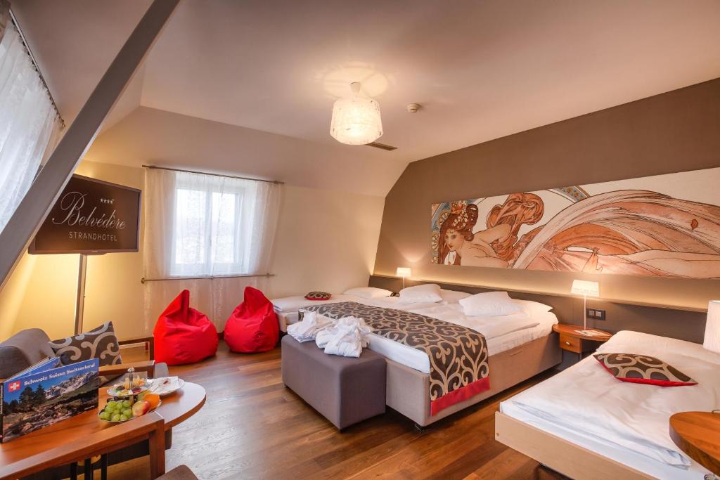 Postel nebo postele na pokoji v ubytování Belvédère Strandhotel