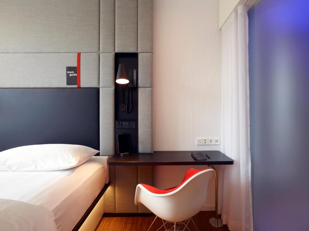 Postel nebo postele na pokoji v ubytování citizenM Geneva