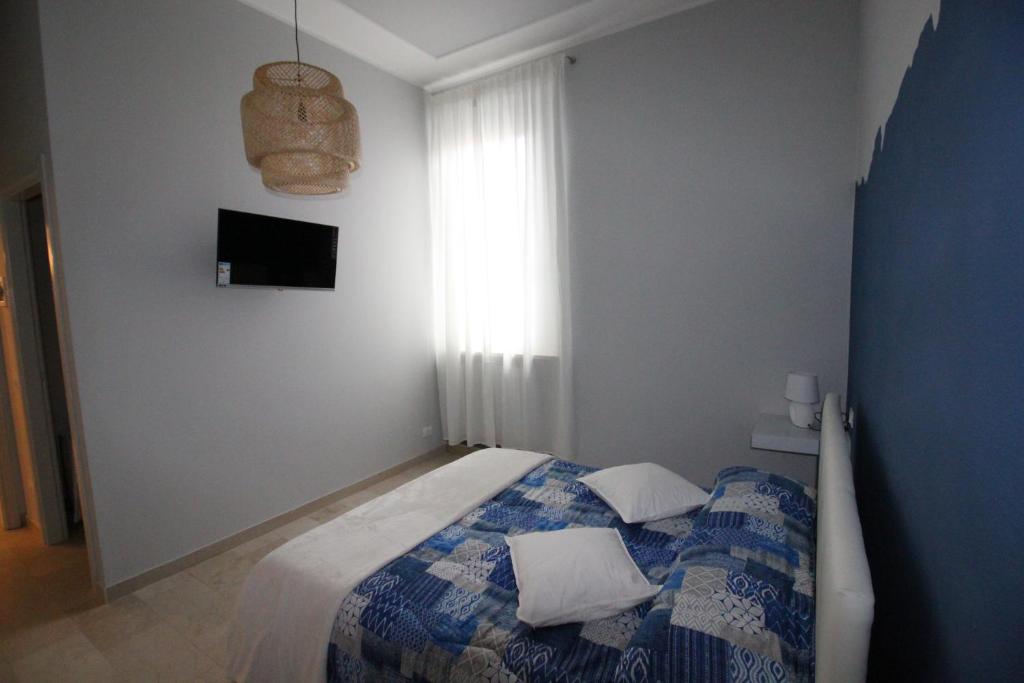 Postel nebo postele na pokoji v ubytování Ad Astra Rooms