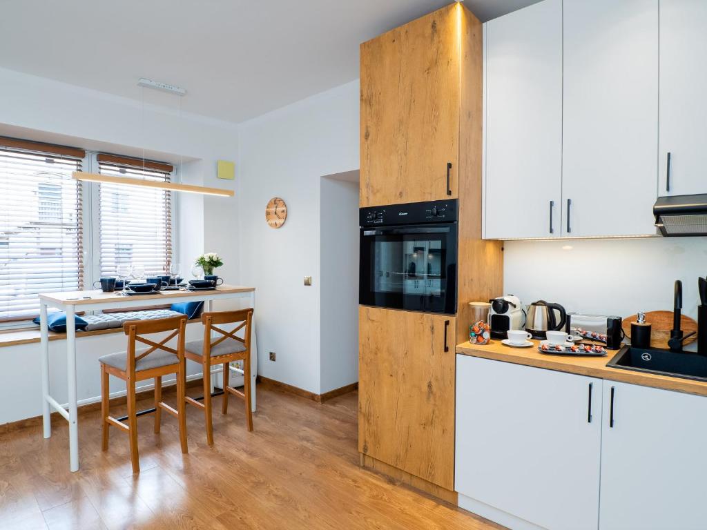 Kuchyňa alebo kuchynka v ubytovaní Apartament DeLux Aleja NMP 8 - Free parking