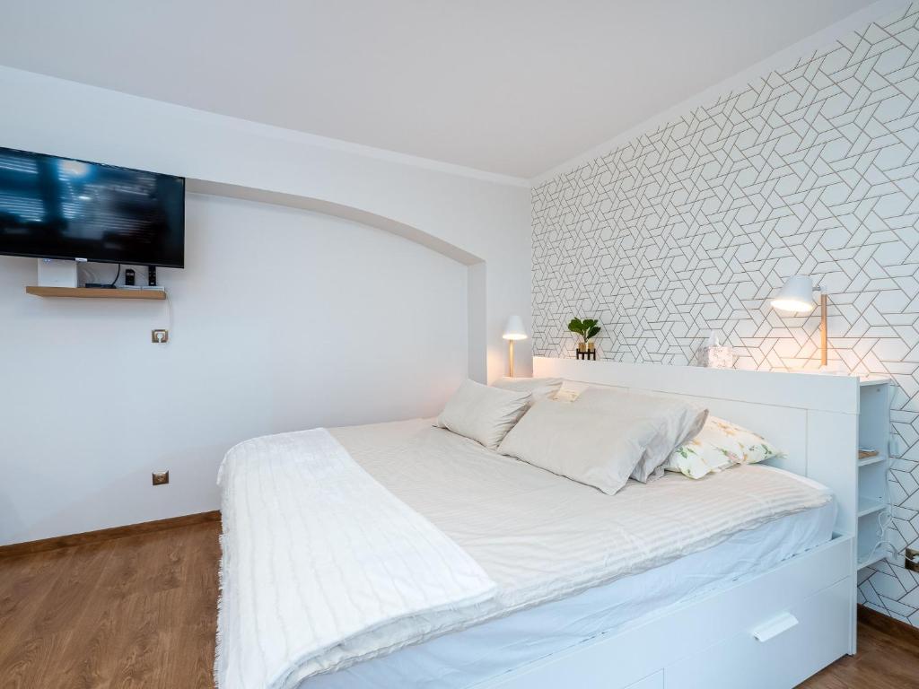 Posteľ alebo postele v izbe v ubytovaní Apartament DeLux Aleja NMP 8 - Free parking