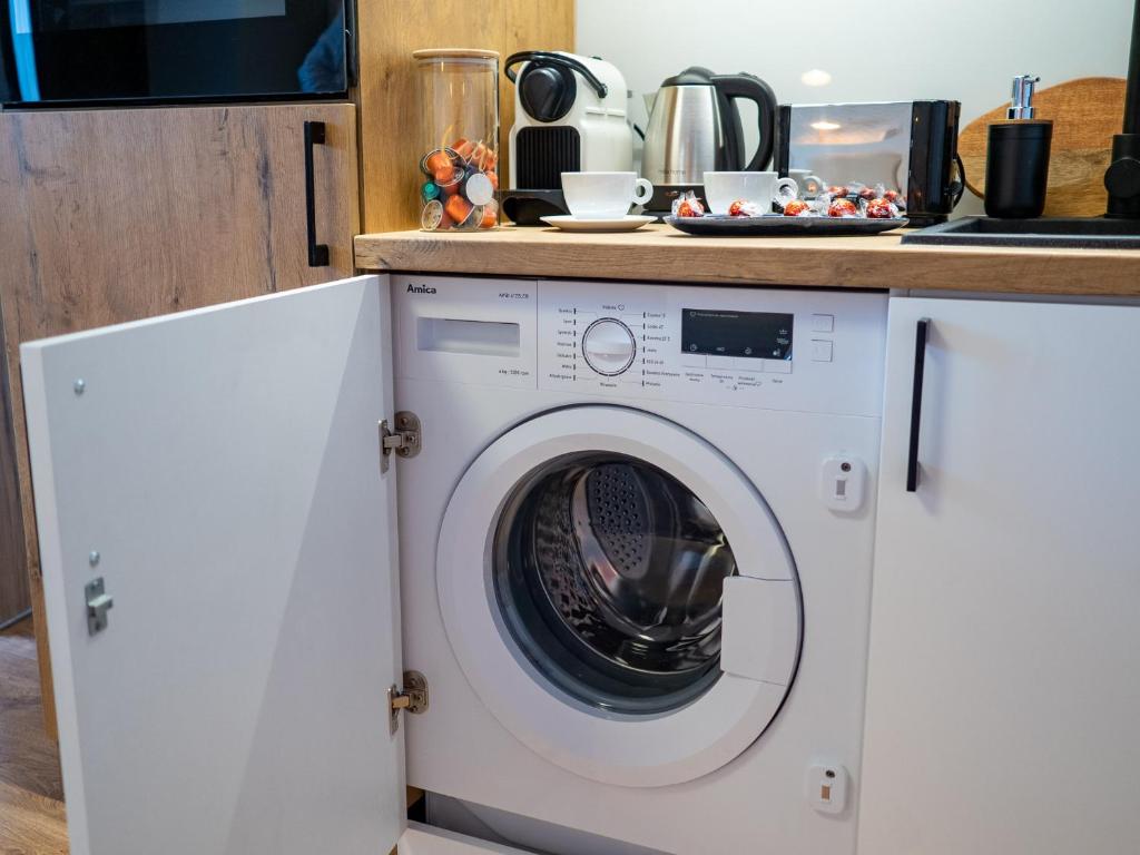 Kuchyňa alebo kuchynka v ubytovaní Apartament DeLux Aleja NMP 8 - Free parking