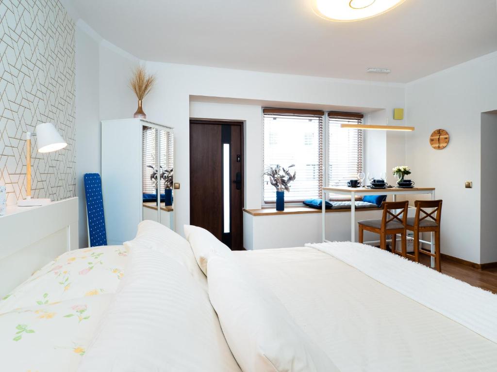 Posteľ alebo postele v izbe v ubytovaní Apartament DeLux Aleja NMP 8 - Free parking