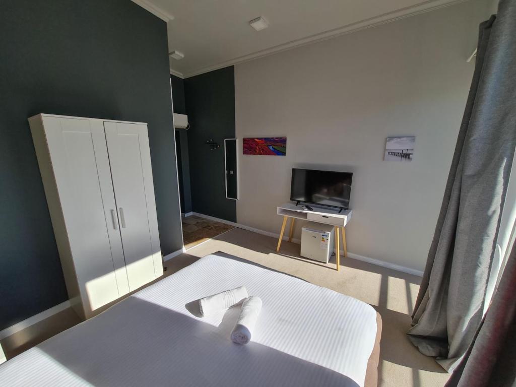 Postel nebo postele na pokoji v ubytování La Vella Resort