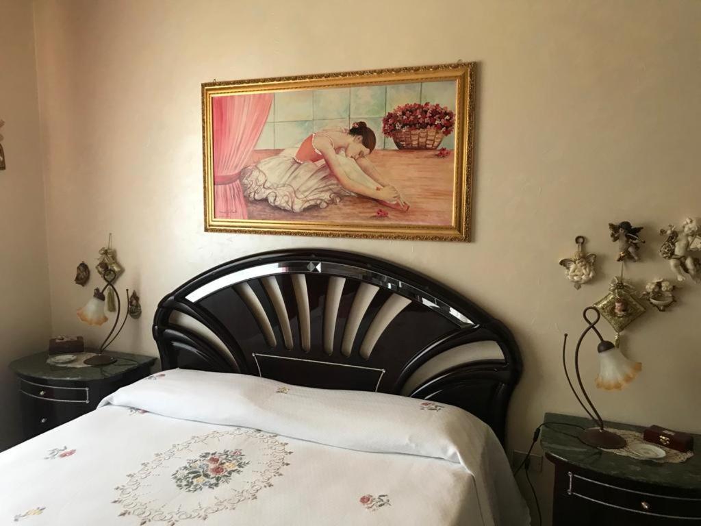 Posteľ alebo postele v izbe v ubytovaní Casa Vacanza Nonna Adri