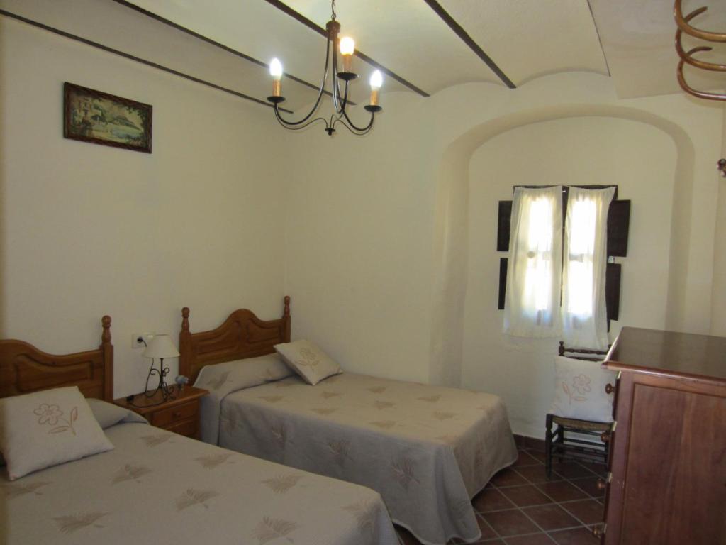 Postel nebo postele na pokoji v ubytování Cortijo "Era Grande 1"