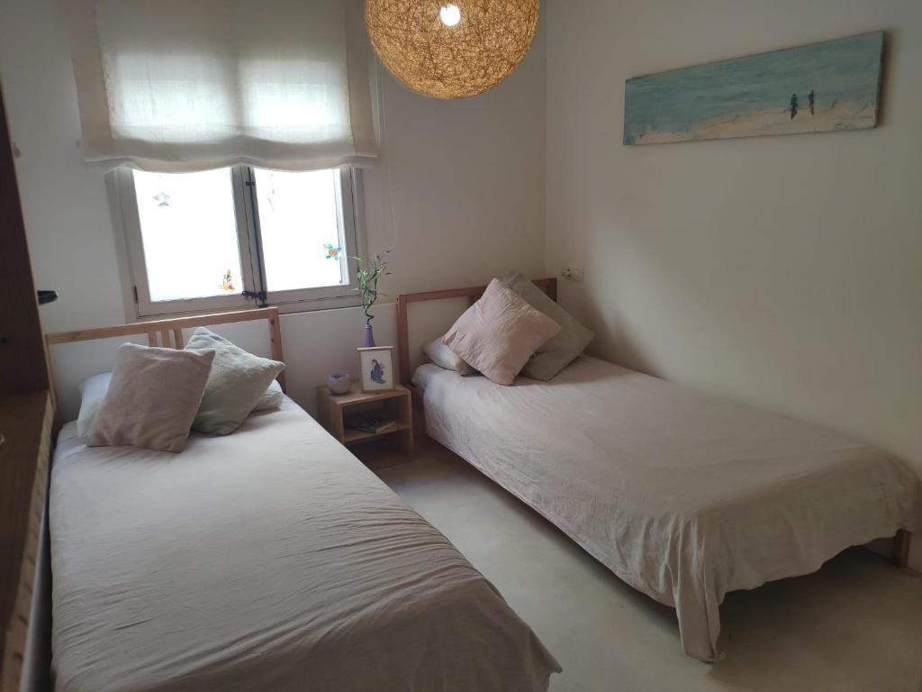 Postel nebo postele na pokoji v ubytování Casa De La Mar 19