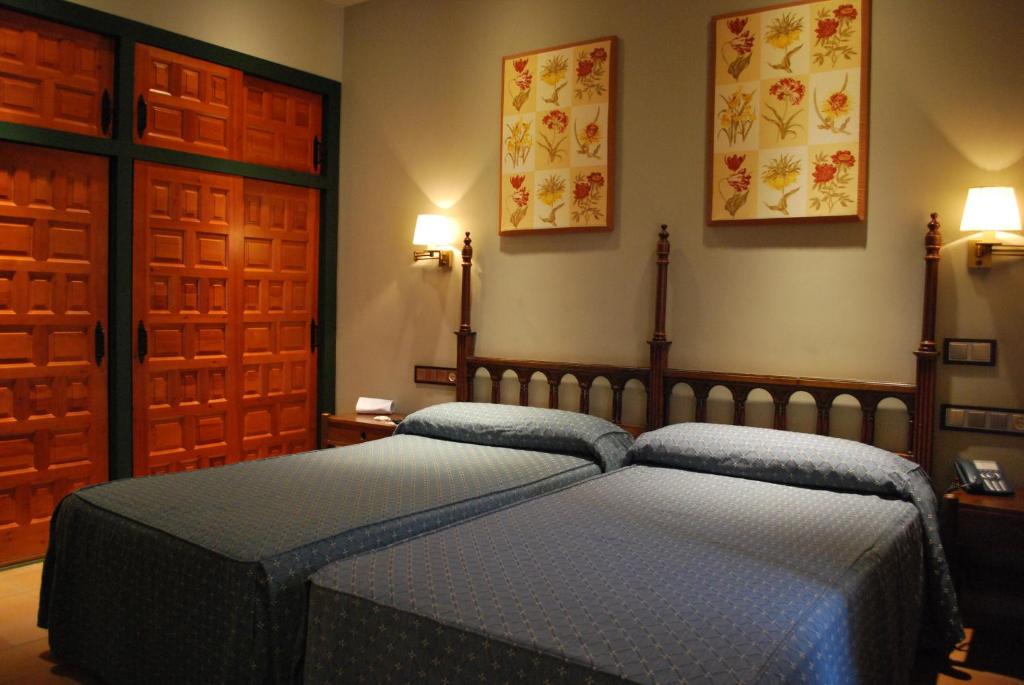 Postel nebo postele na pokoji v ubytování Parador de Cazorla