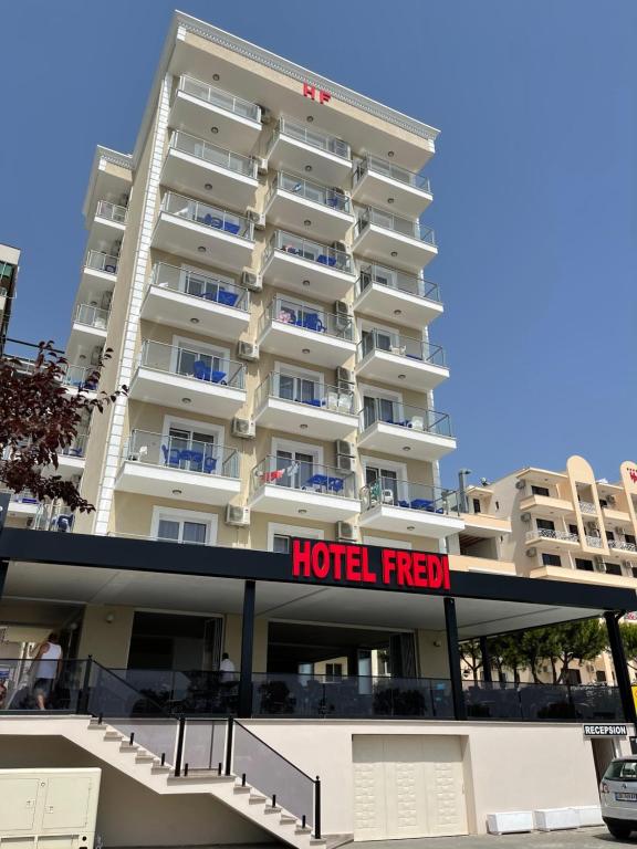 a hotel with a hotel fresh sign in front of it at Hotel Fredi Shengjin in Shëngjin