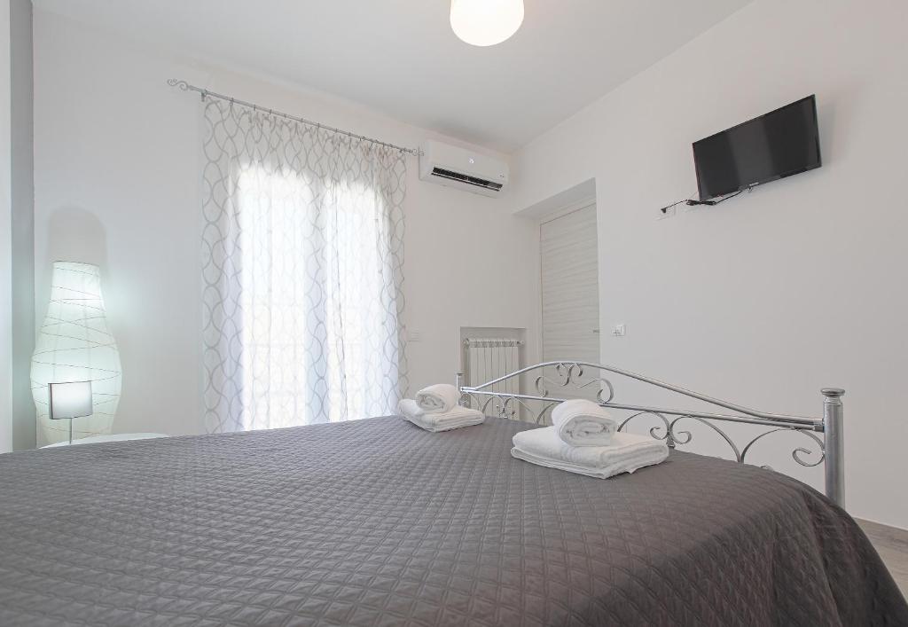 A bed or beds in a room at La casa di Vittoria