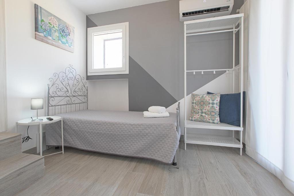 A bed or beds in a room at La casa di Vittoria