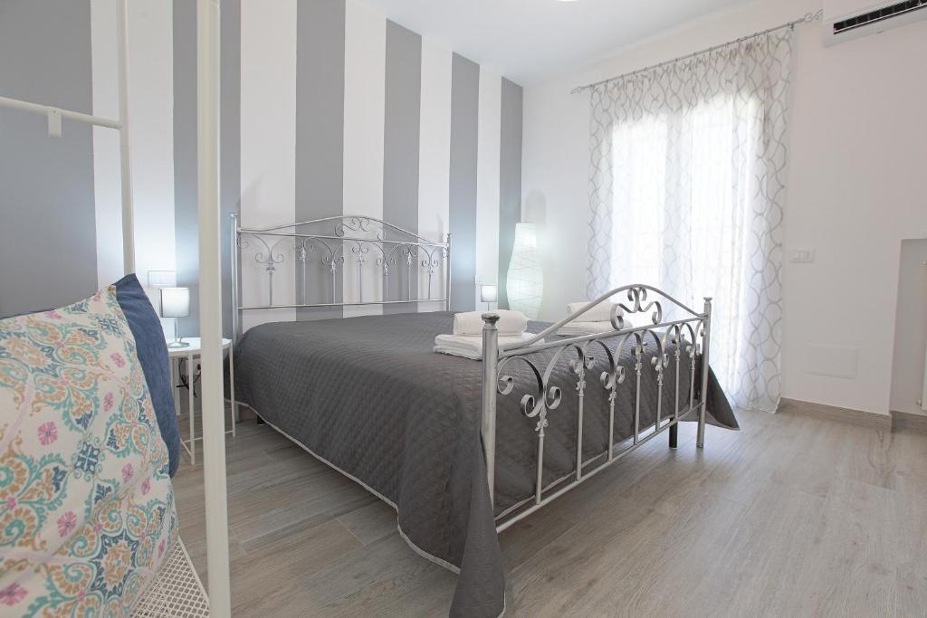 A bed or beds in a room at La casa di Vittoria