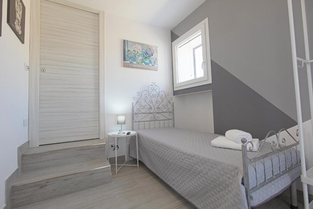 A bed or beds in a room at La casa di Vittoria