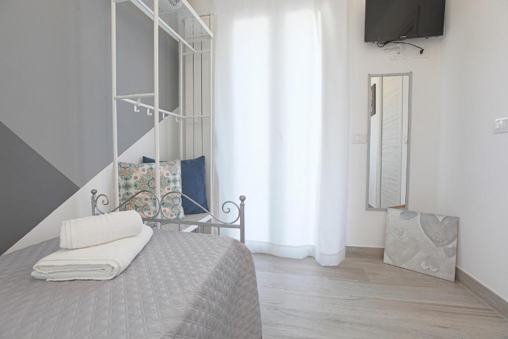 A bed or beds in a room at La casa di Vittoria