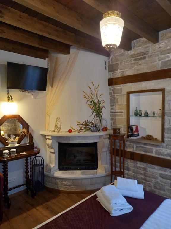 TV a/nebo společenská místnost v ubytování Gioraldi Art Hotel