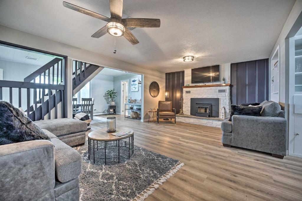 a living room with two couches and a fireplace at Stylish Warsaw Home with Fire Pit and Lake Access in Warsaw