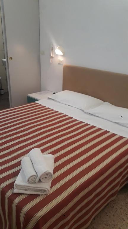 Postel nebo postele na pokoji v ubytování Hotel Graziella Mare