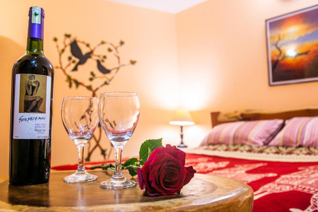 Postel nebo postele na pokoji v ubytování ITCHIMBIA GARDEN con la mejor vista de Quito y SPA