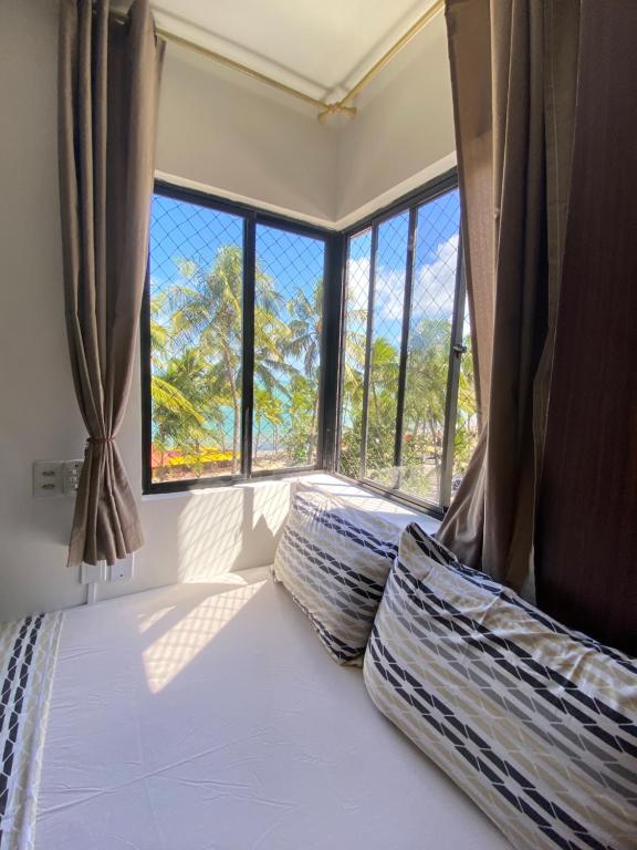 A bed or beds in a room at Edifício Casa Mar