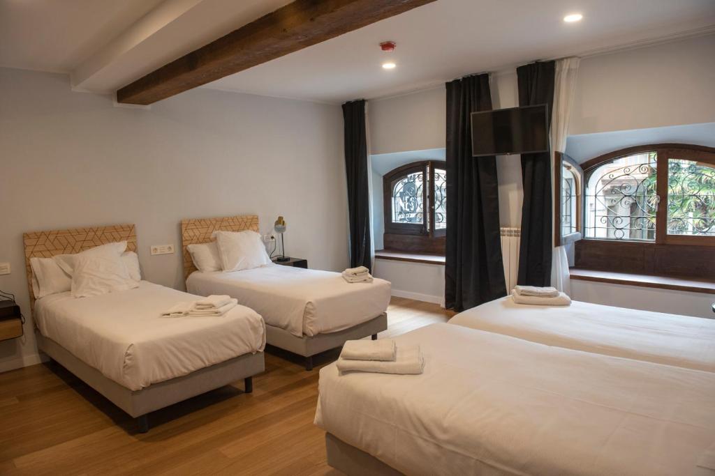 Hotel Puerto de Llanes 객실 침대