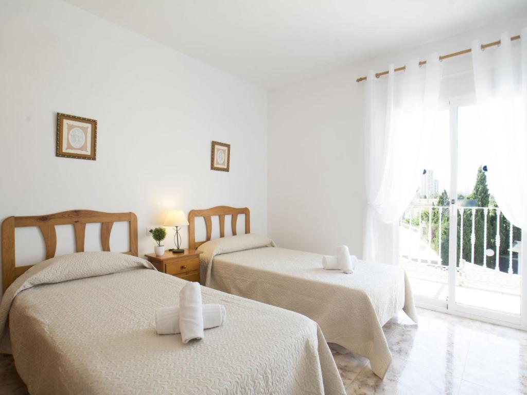 Posteľ alebo postele v izbe v ubytovaní Villa Gardenia by Interhome
