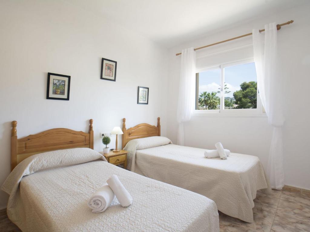 Posteľ alebo postele v izbe v ubytovaní Villa Gardenia by Interhome