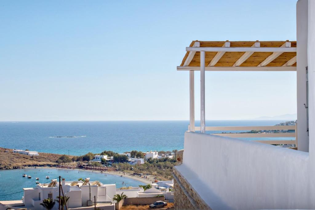 a view of the ocean from a hotel balcony at Horizon Villas in Agios Ioannis Tinos